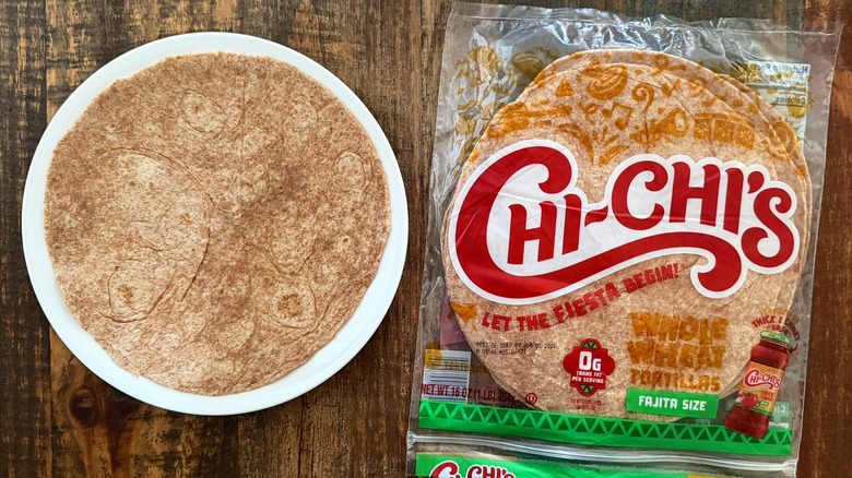 A package of Chi-Chi's Whole Wheat Tortillas next to a tortilla on a plate