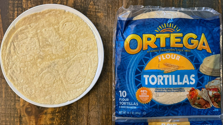 A package of Ortega Flour Tortillas next to a tortilla on a plate