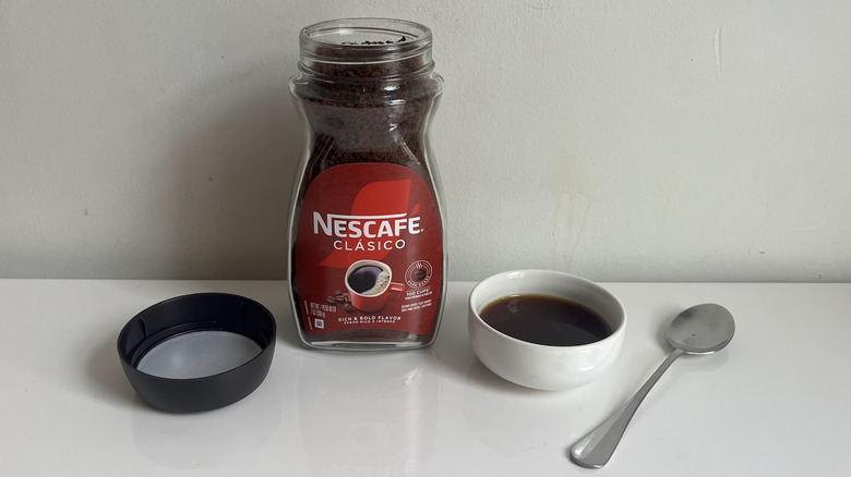 A container of Nescafé Clásico instant coffee