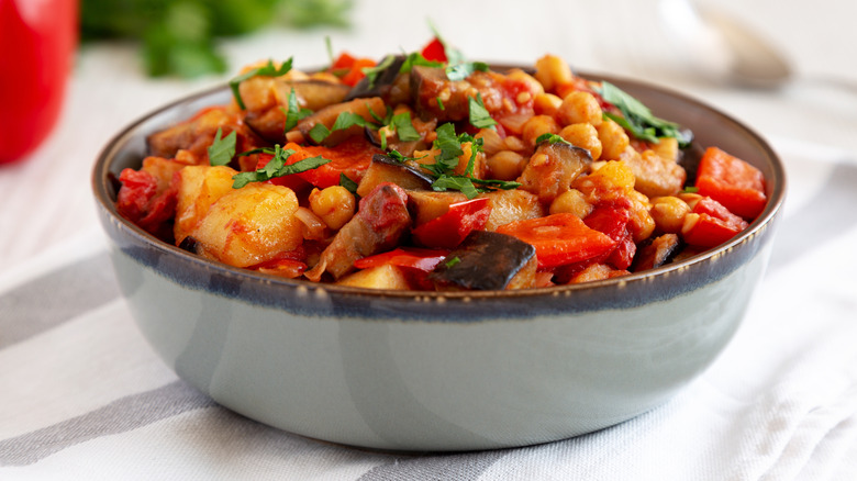 Bowl of stew filled with vegetables