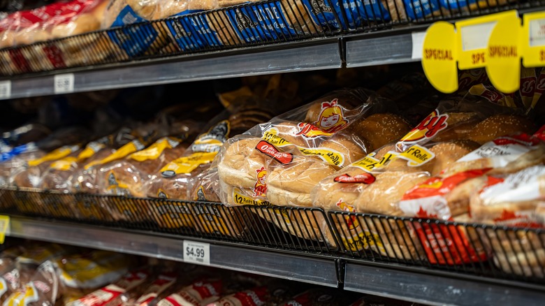 packages of sandwich bread on grocery store shelves
