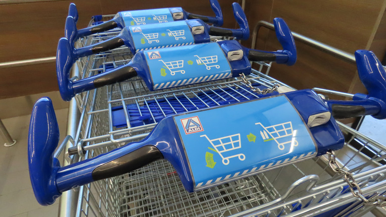 Aldi shopping carts in a line with the coin slot on the right side