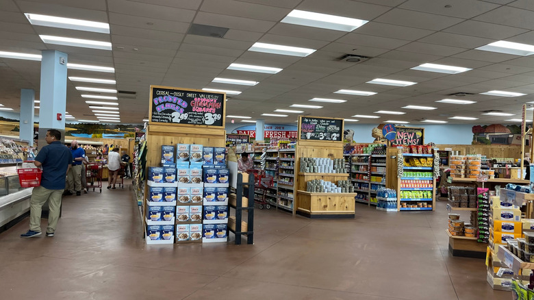 Trader Joe's interior showing several aisles and part of a checkout area as well as several shoppers