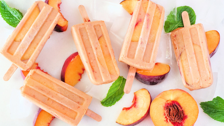 Peach yogurt ice pops, with peaches and basil