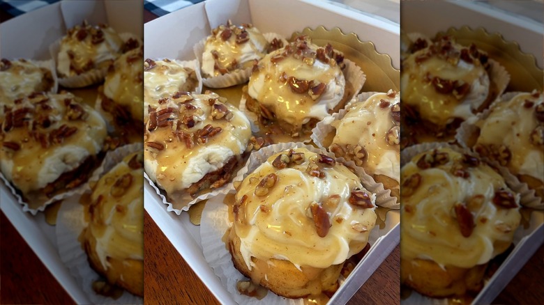 Cinnamon rolls covered with pecans and whiskey sauce