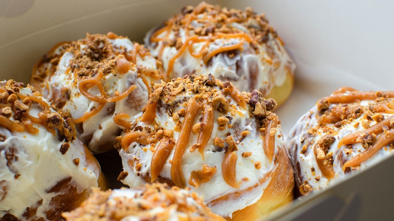 Cinnamon rolls drizzled with caramel syrup