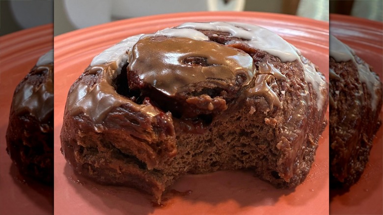 Chocolate cinnamon roll on red plate