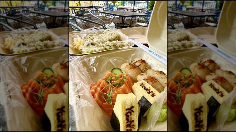 A takeout dish from Yoshi's Sushi in Portland, Oregon, on an outdoor table, mirrored