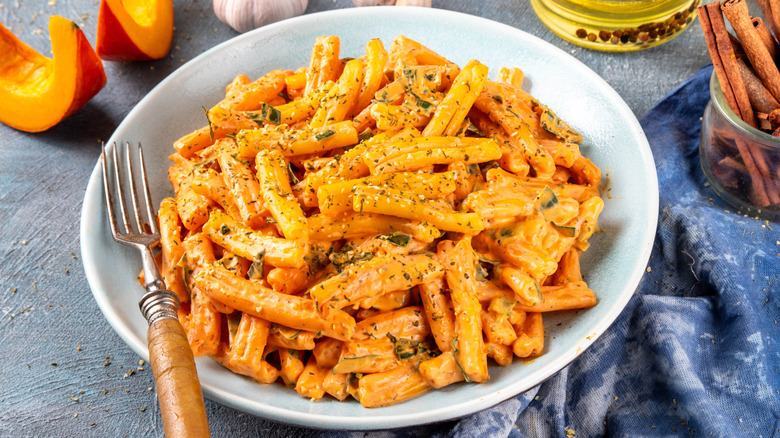 a bowl of pasta with pumpkin sauce