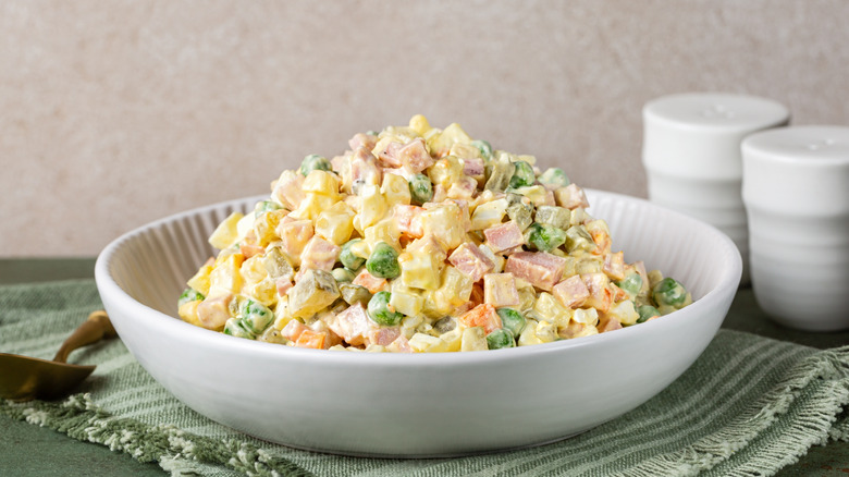 White bowl of Olivier salad