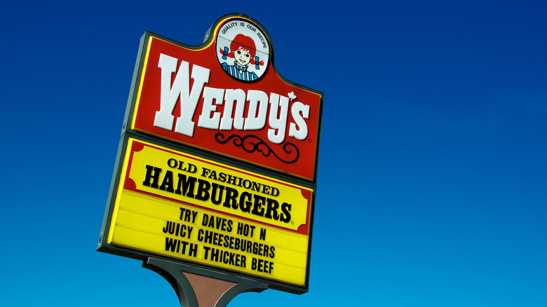 Wendy's sign inm front of blue sky