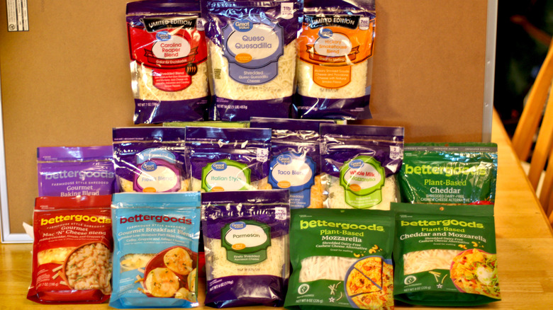 An array of 14 different bags of shredded cheese from Walmart's Bettergoods and Great Value Brands
