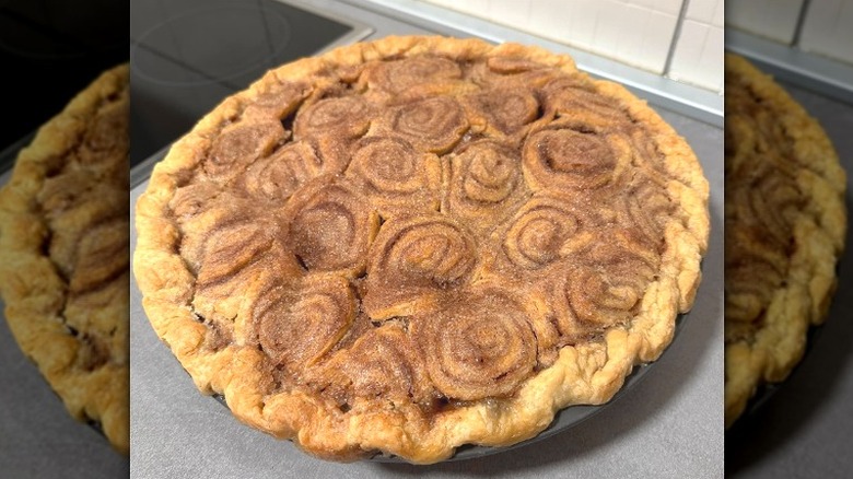 a pie with a crust made of cinnamon rolls