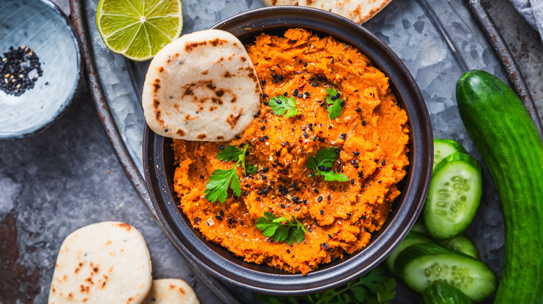flatbread dipped in lentil dip