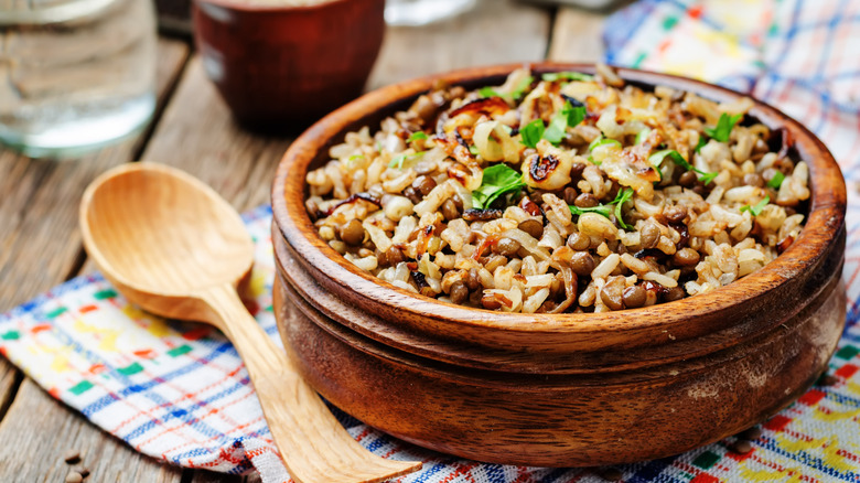 lentils and rice in wooden bowl
