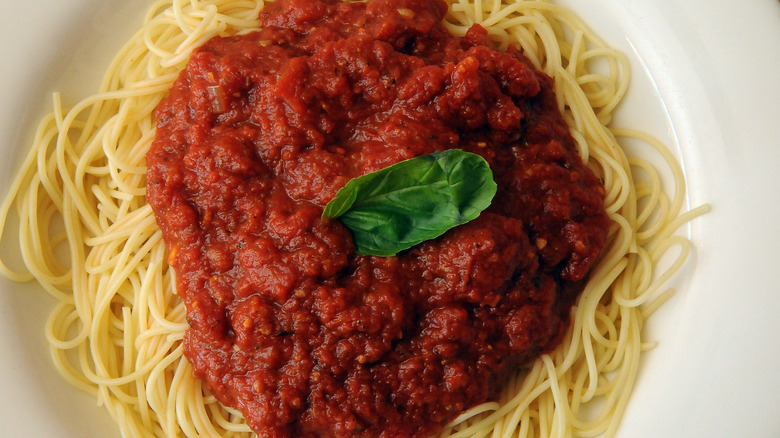 spaghetti with red sauce on a plate