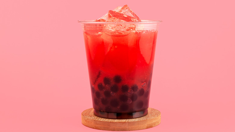 berry bubble tea in a plastic glass with ice