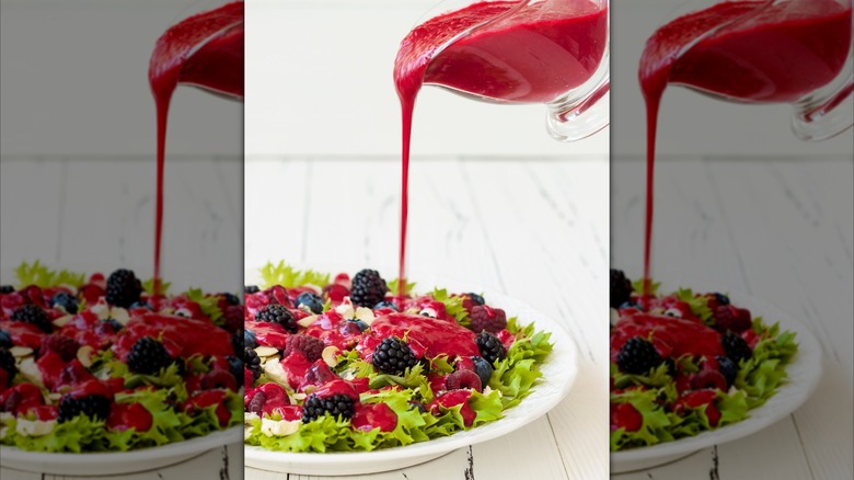 berry vinaigrette poured over fresh fruit and greens salad