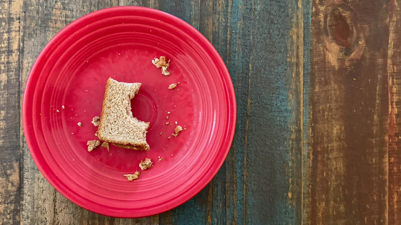 a partially eaten sandwich on a plate