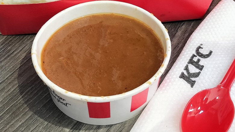 Close-up of KFC gravy alongside a spoon