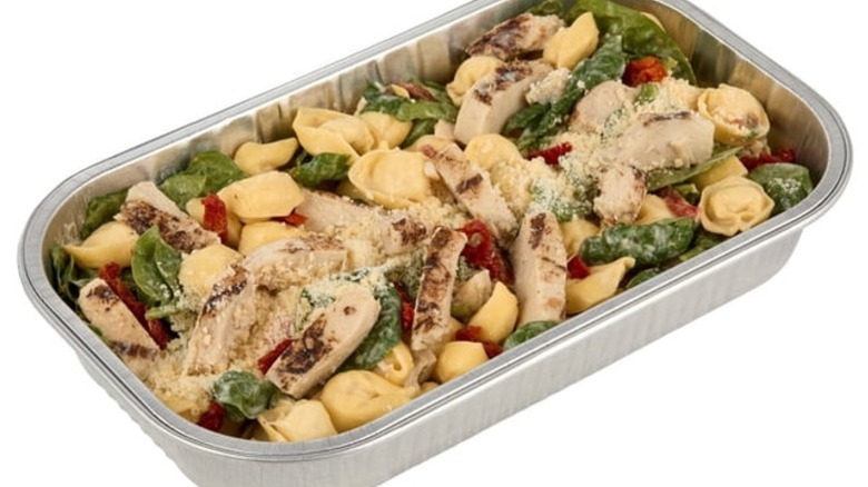 Member's Mark Marry Me Chicken with Tortellini in a foil pan on a white background.