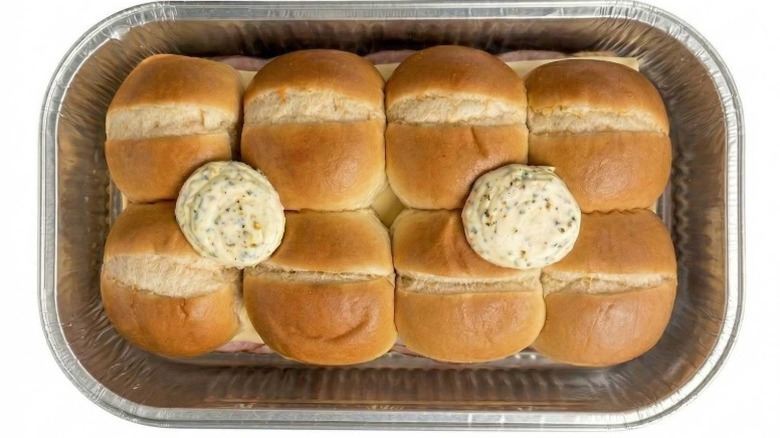 Member's Mark Uncured Ham and Cheese Sliders in a foil container on a white background.
