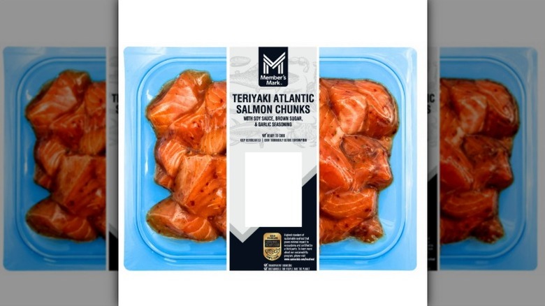 Member's Mark Teriyaki Seasoned Salmon Chunks in clear blue plastic packaging on a white background.