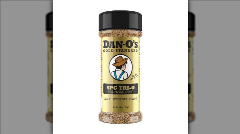 A jar of Dan-O's SPG Tri-O All-Purpose Seasoning on a white background.