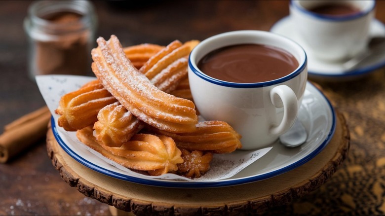 Crispy Spanish Churros with a cup of chocolate for dipping