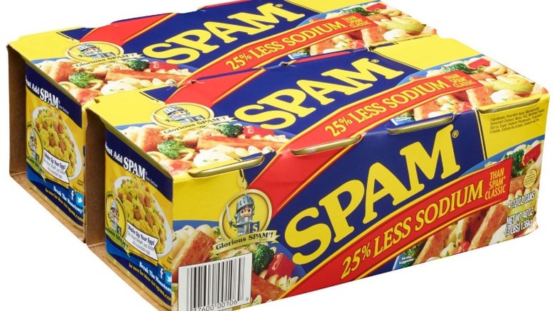 cans of 25% Less Sodium Spam in a cardboard carton