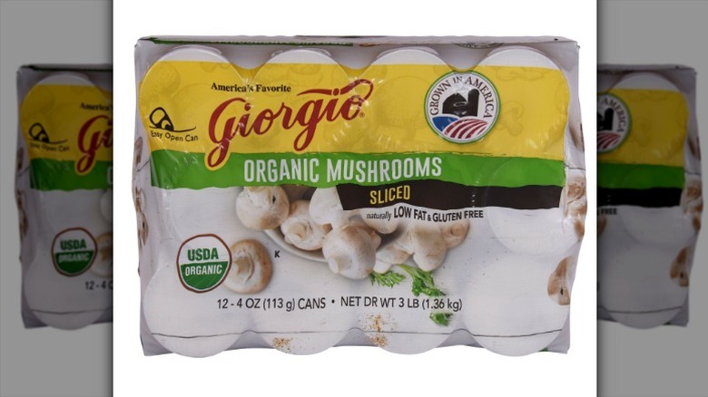 cans of Giorgia Organic Sliced Mushrooms in a shrink-wrapped cardboard carton
