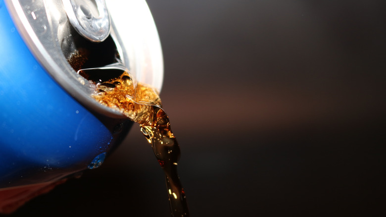Can of soda being poured