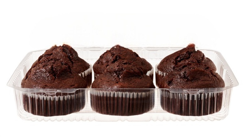 Member's Mark Double Chocolate Muffins in clear plastic packaging on a white background.
