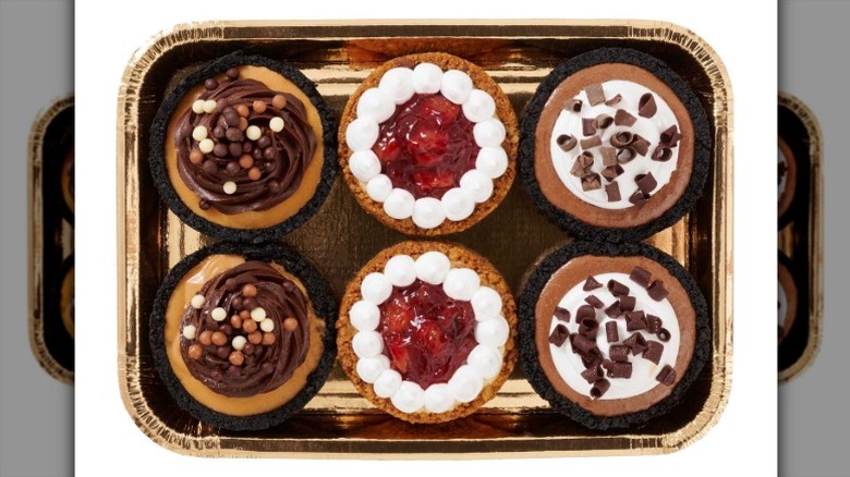 Member's Mark 4-inch Assorted Mini Pies in a foil tray on a white background.