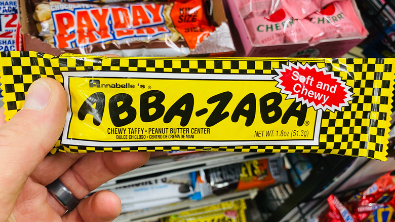 hand holding an Abba-Zaba candy bar