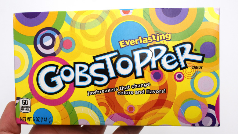hand holding a box of Everlasting Gobstoppers