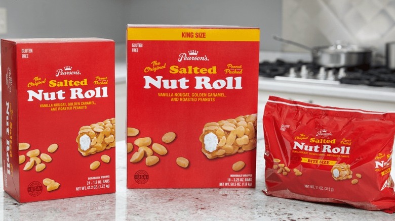 two boxes and one bag of Pearson's Salted Nut Rolls sitting on a kitchen counter