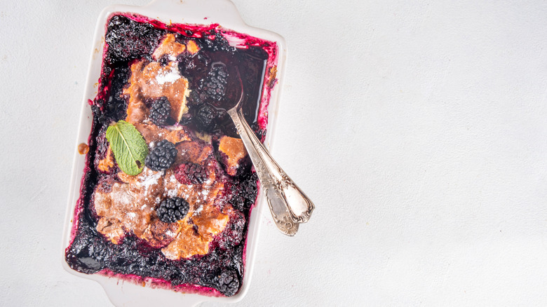 Glas baking dish of mulberry cobbler