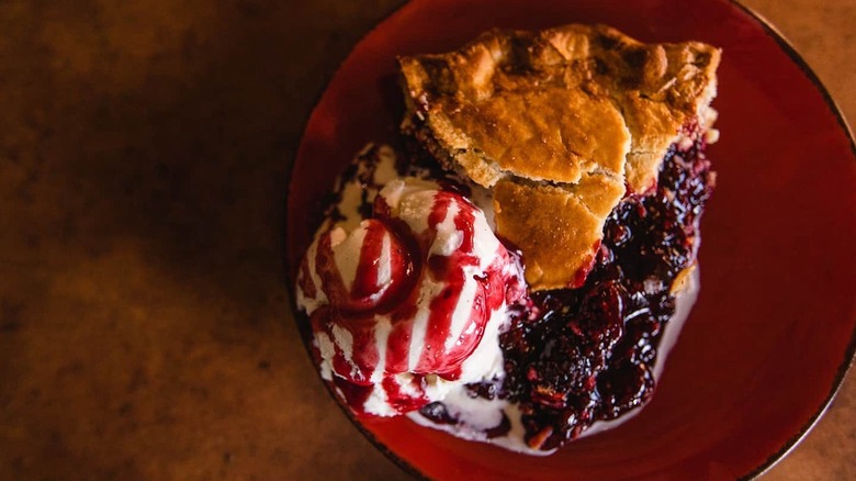 Fruit pie with scoop of vanilla ice cream