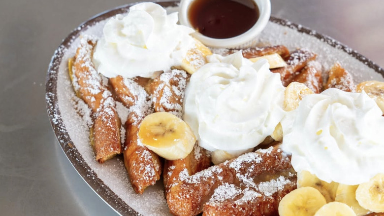 Banana French toast with cream and syrup