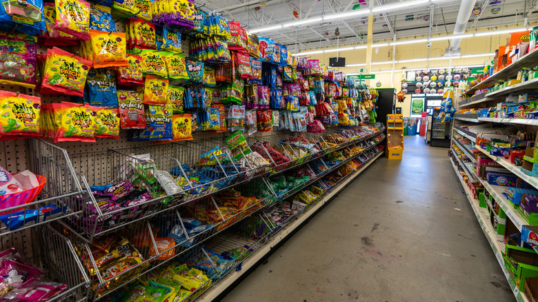 A candy aisle at a Dollar Tree.