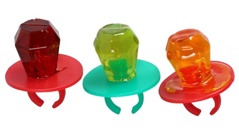 Three Ring Pops in assorted flavors on a white background.