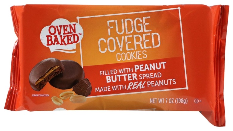 A package of Oven Baked Fudge Covered Cookies Filled With Peanut Butter Spread on a white background.
