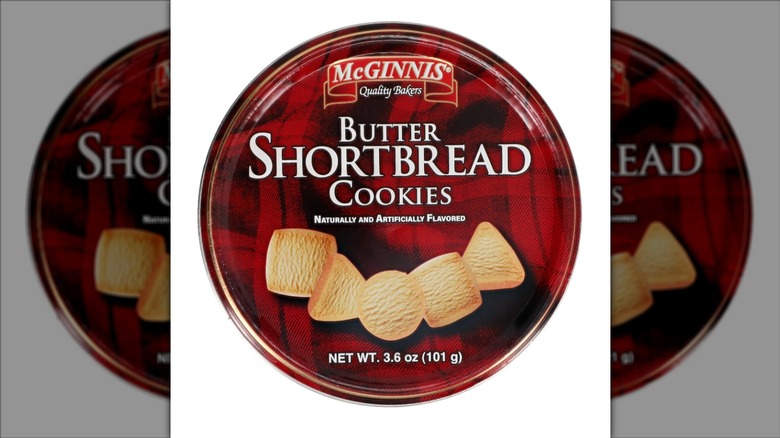 A canister of McGinnis butter-flavored shortbread cookies on a white background.
