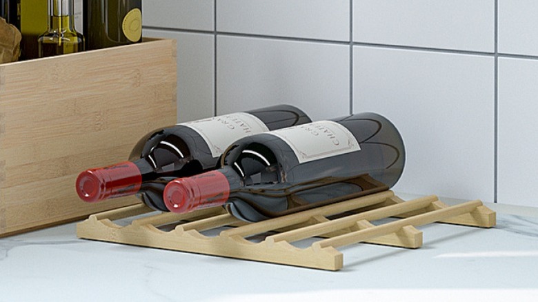 Variera bottle rack holding two wine bottles and sitting on a kitchen counter