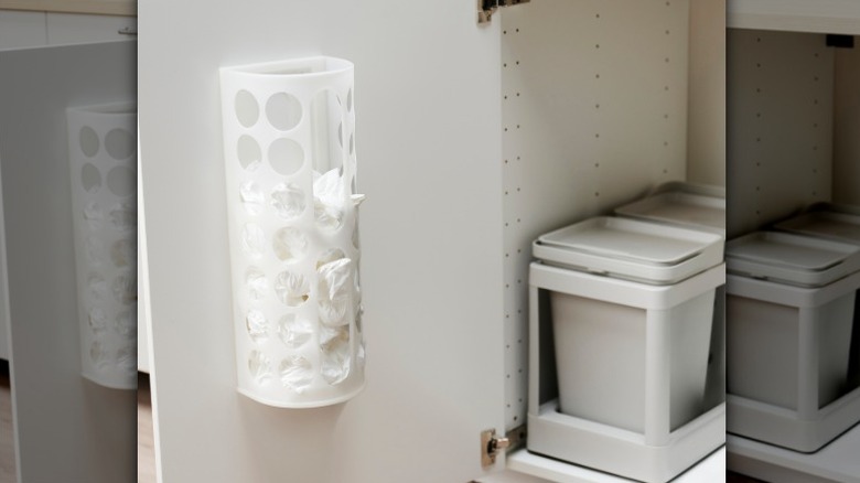 Variera plastic bag dispenser half-filled with white plastic bags hanging inside a cabinet door
