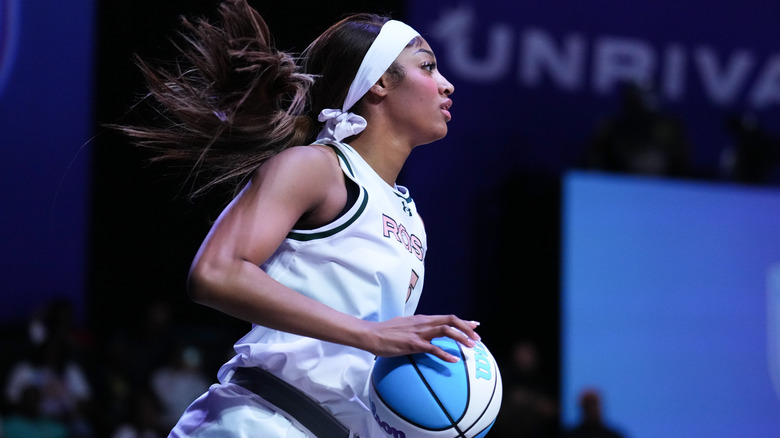 Angel Reese playing basketball