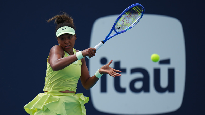 Naomi Osaka playing a game of tennis