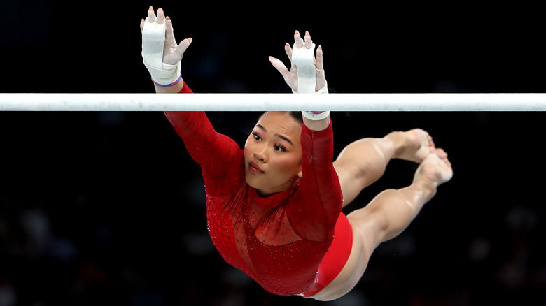 Suni Lee mid-swing at the Olympics