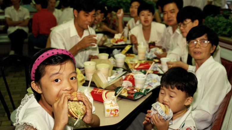 Photo of family enjoying McDonald's in a food court